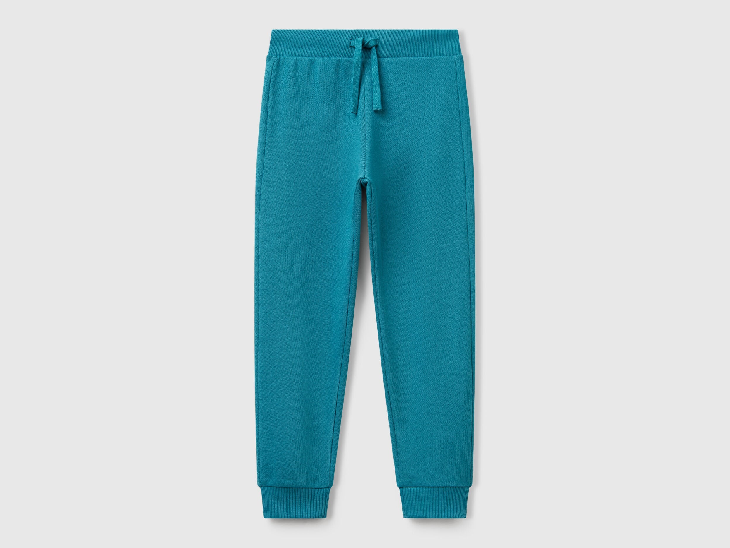 Benetton boys blue sporty trousers front view with drawstring waist