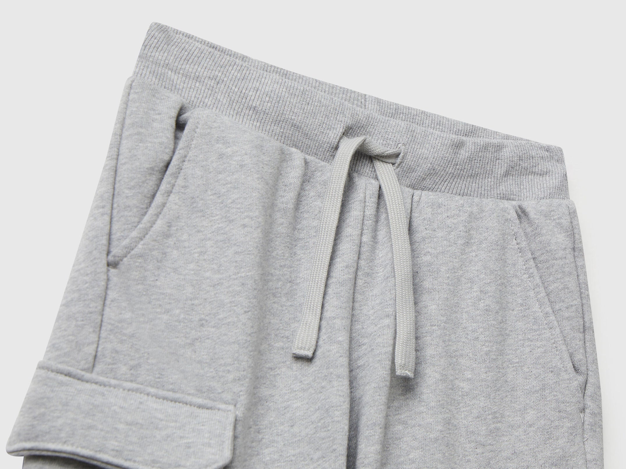 Back view of Benetton grey cargo joggers with drawstring waist