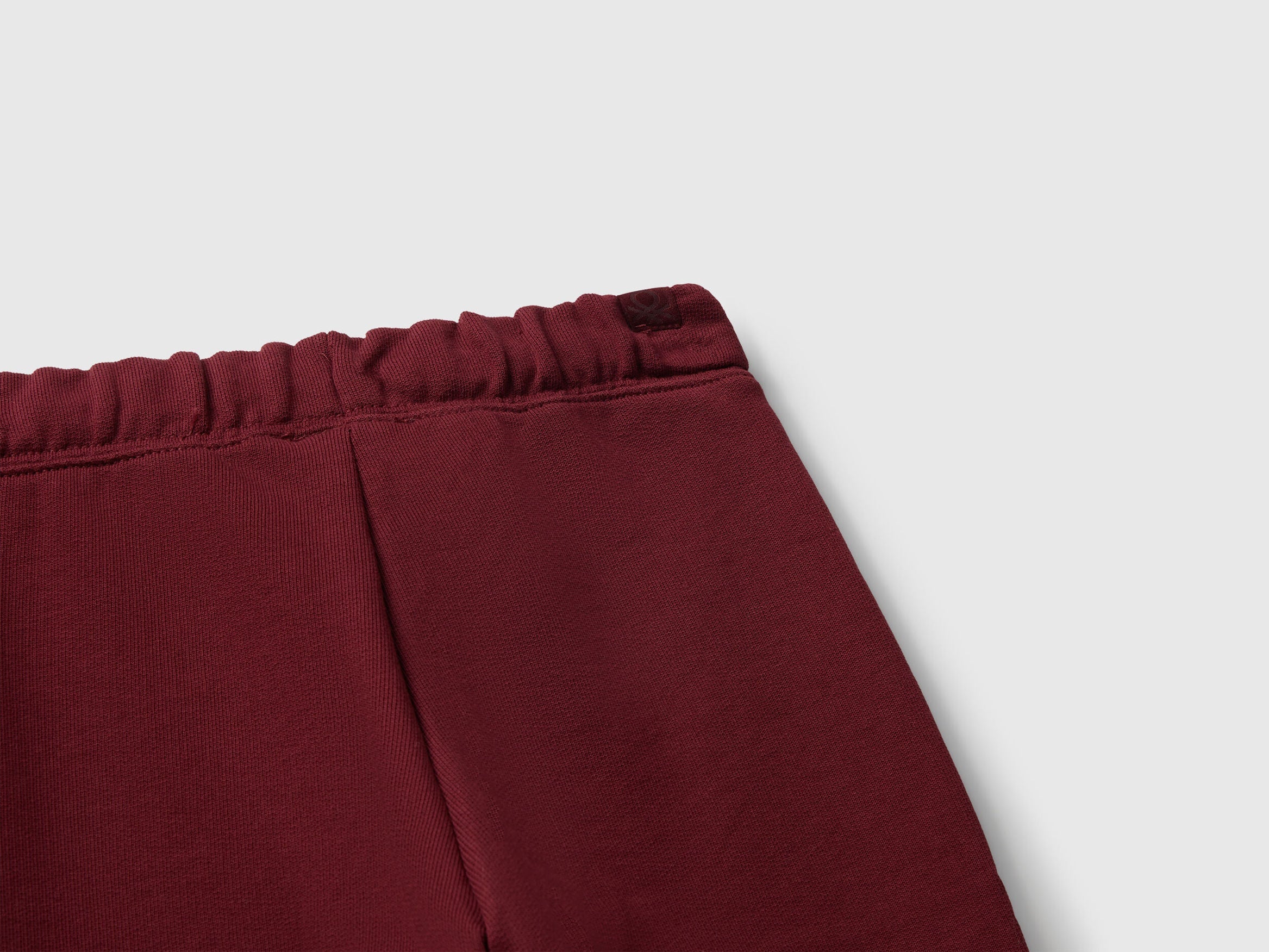 Back view of Benetton sweat joggers with logo detail
