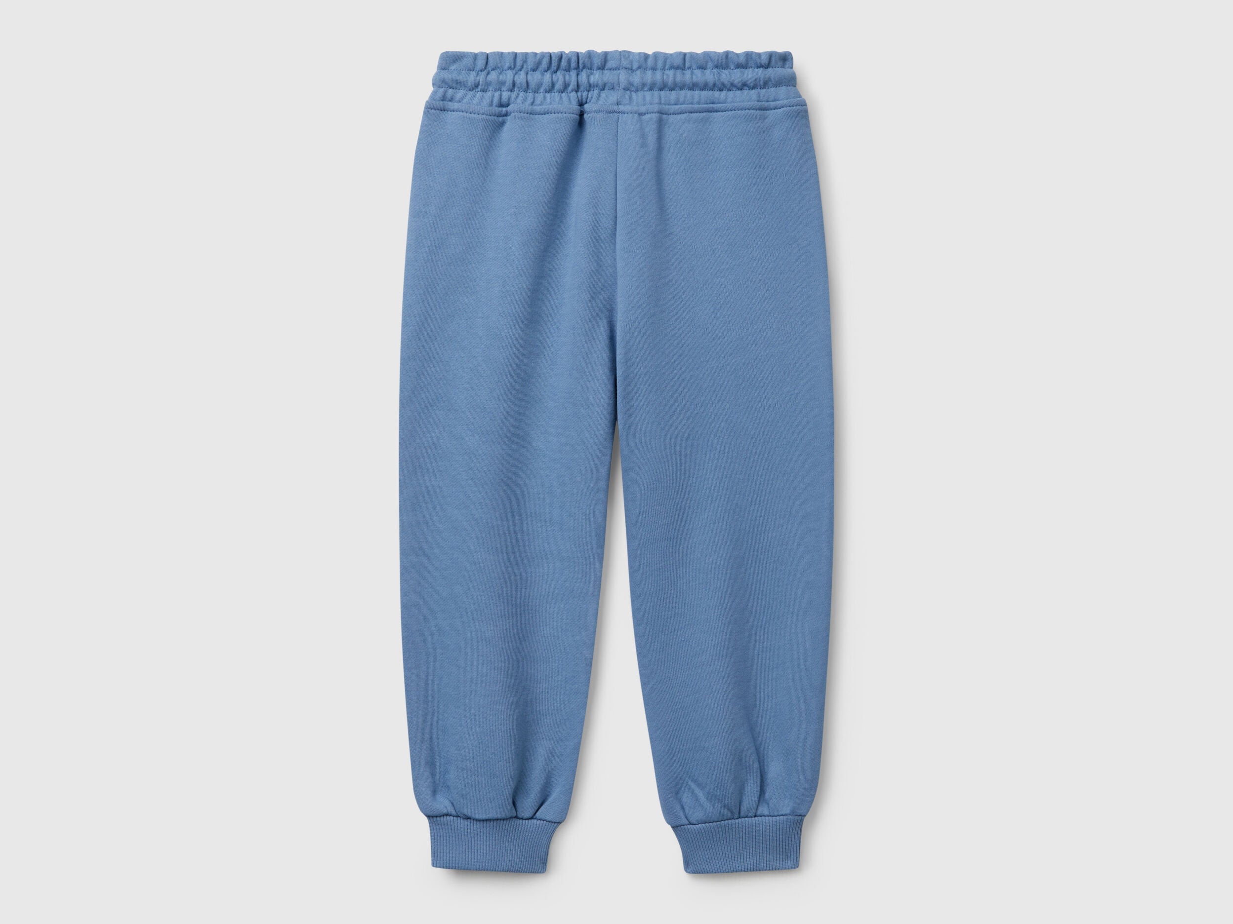 Back view of Benetton sweatpants with elastic bottom detail