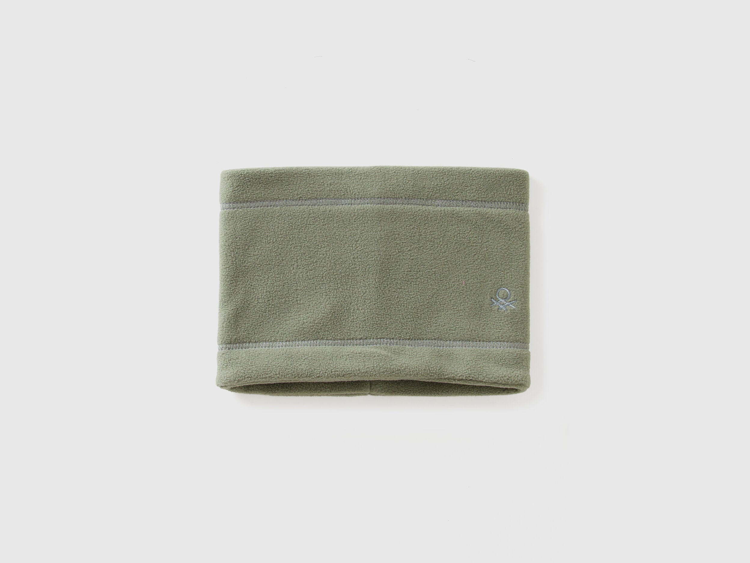 Green fleece neck warmer, folded flat, soft winter accessory.