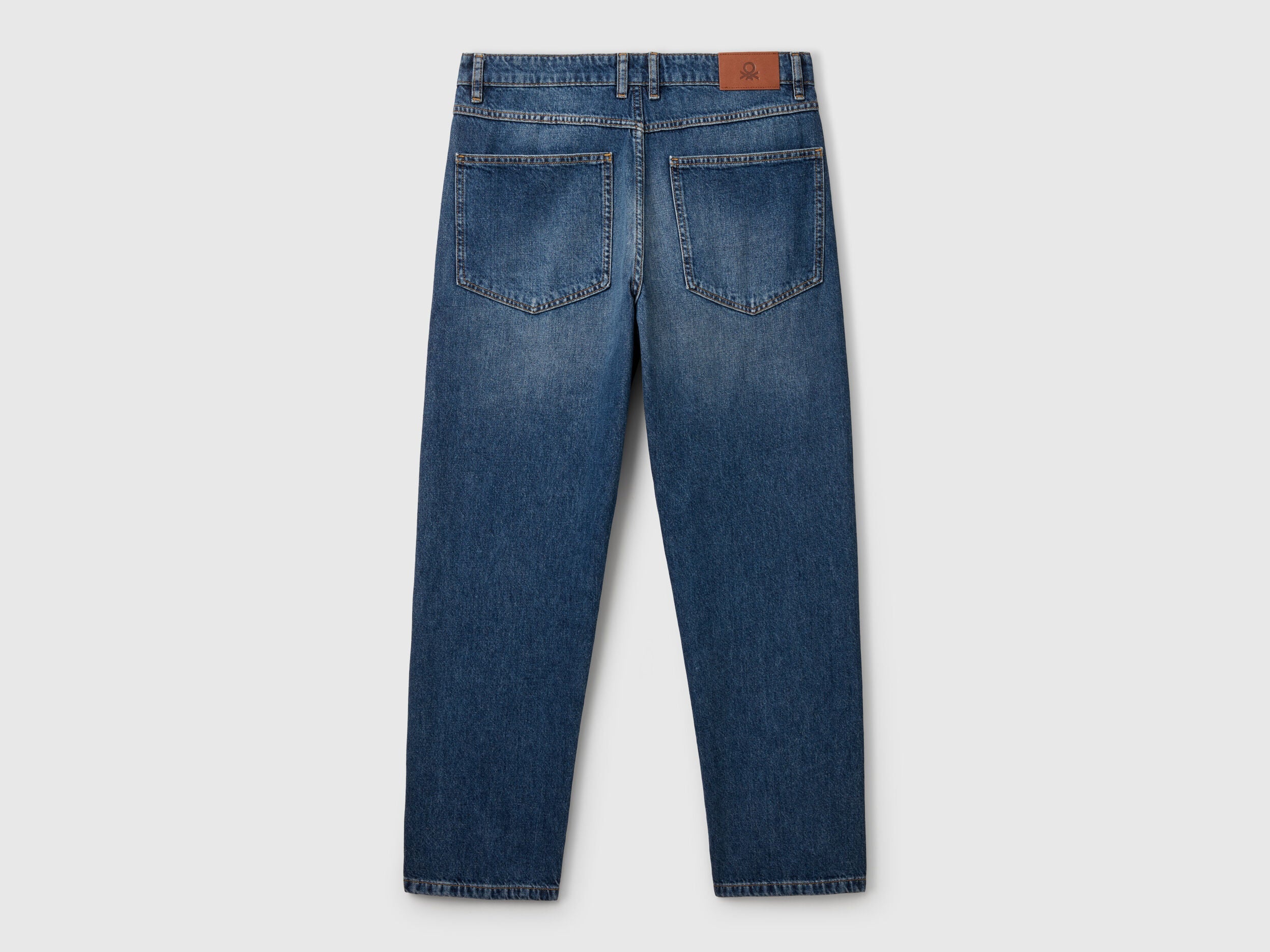 Close-up of the back pocket and leather patch on a pair of men&