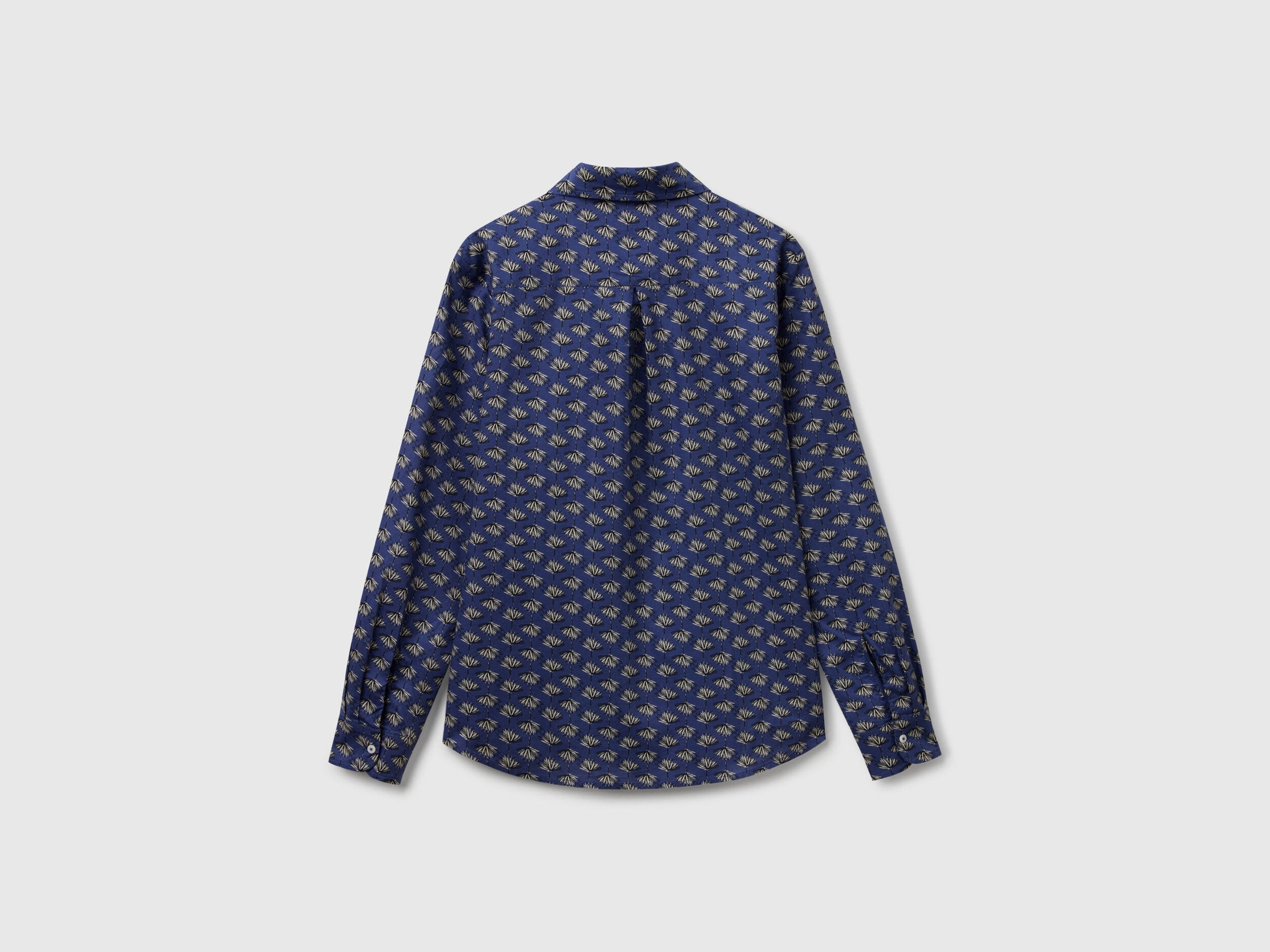 Flat back view of a dark blue patterned shirt for women, available online in Kuwait.