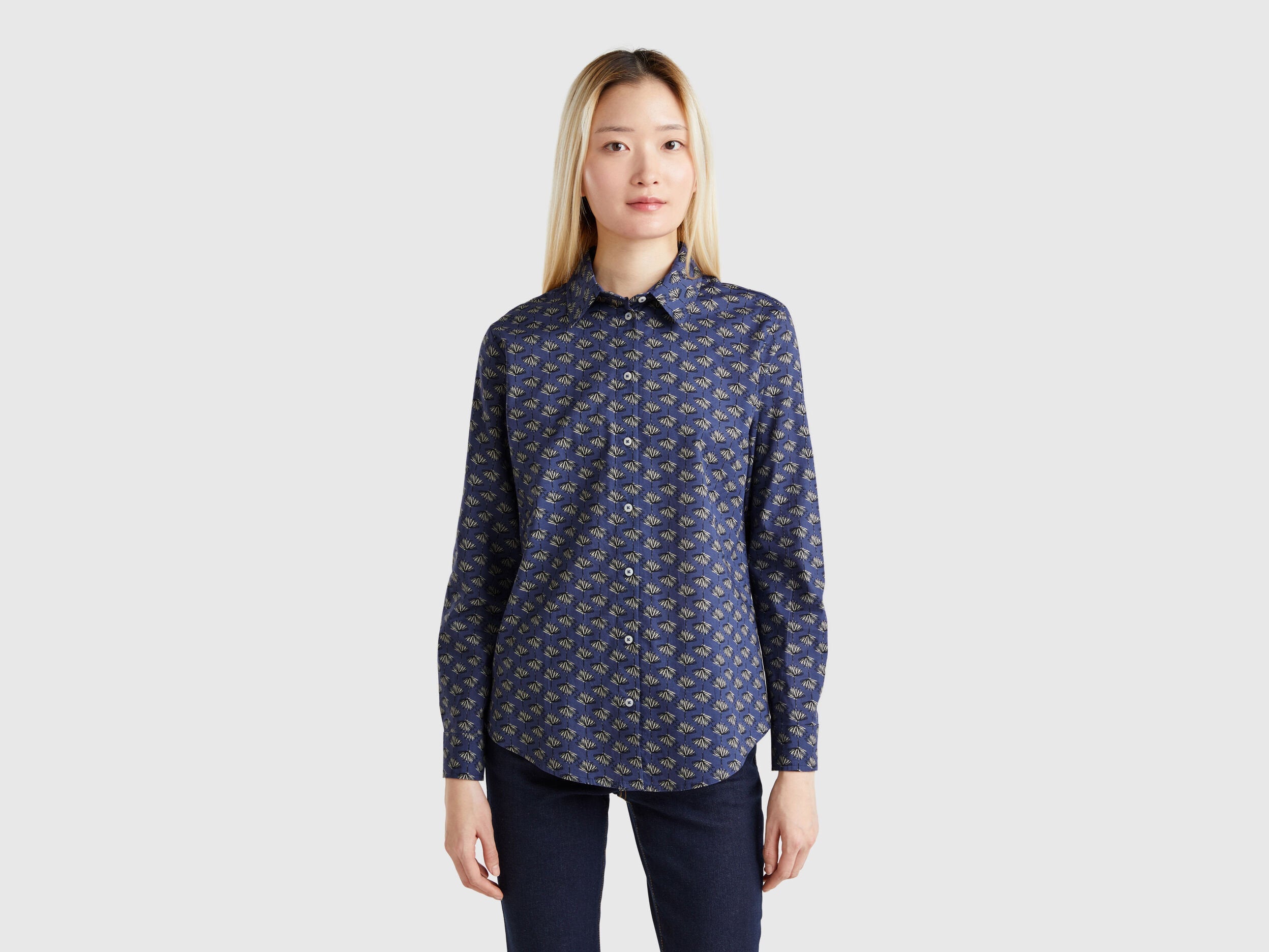 Front view of a dark blue patterned shirt for women, available in Kuwait.