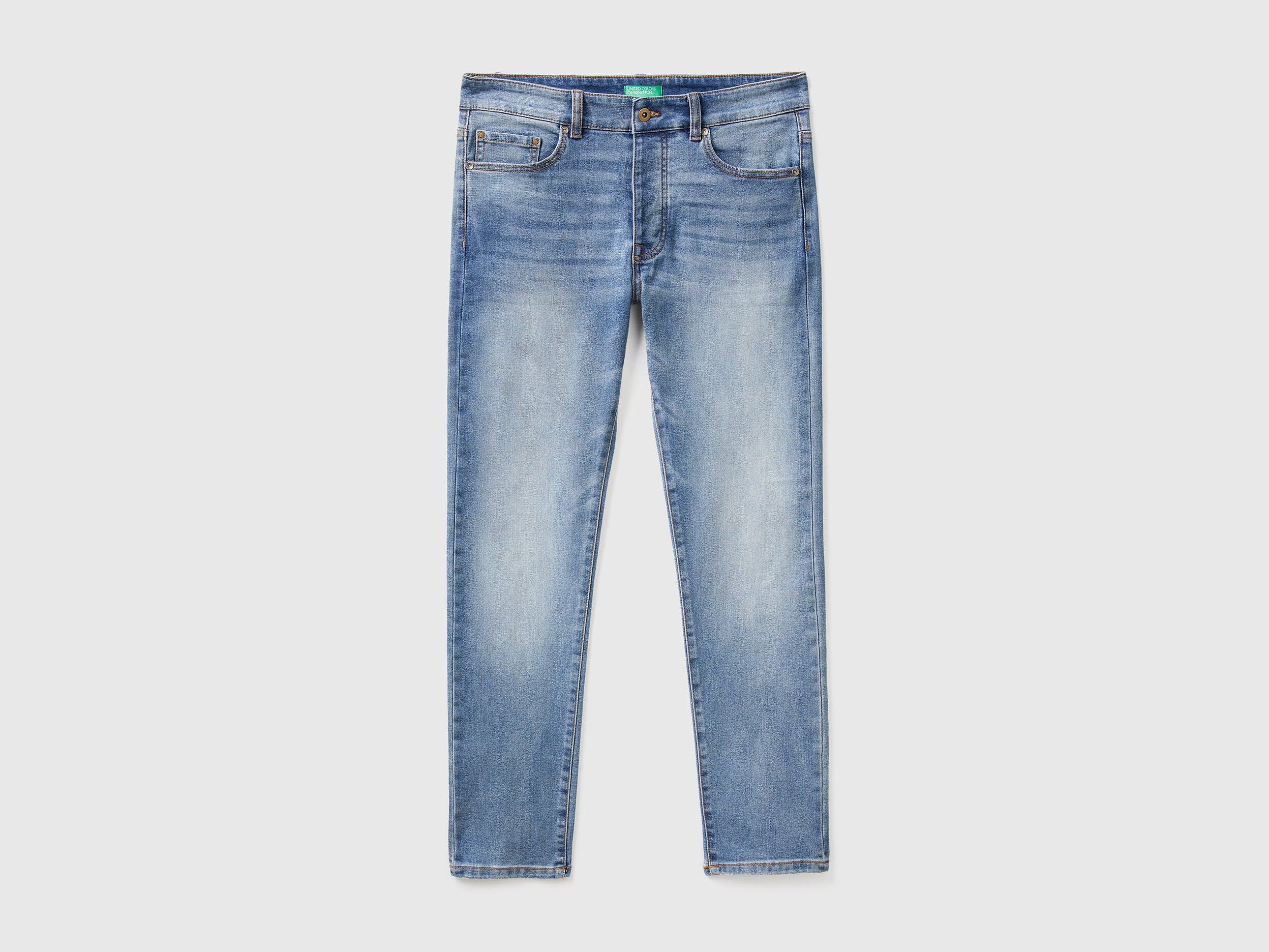 Flat lay back view of black slim-fit jeans for men.