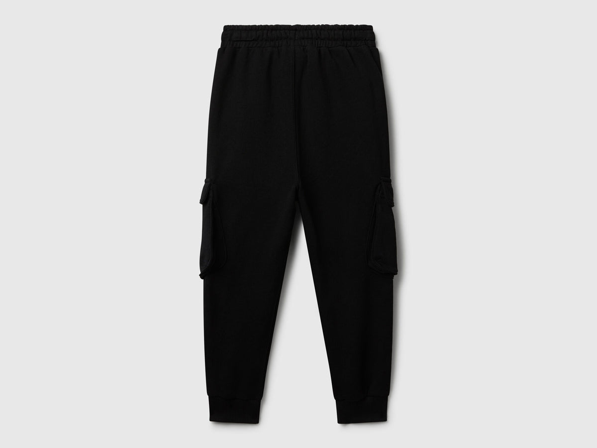 Benetton black sweat fabric joggers side view showing cargo detail