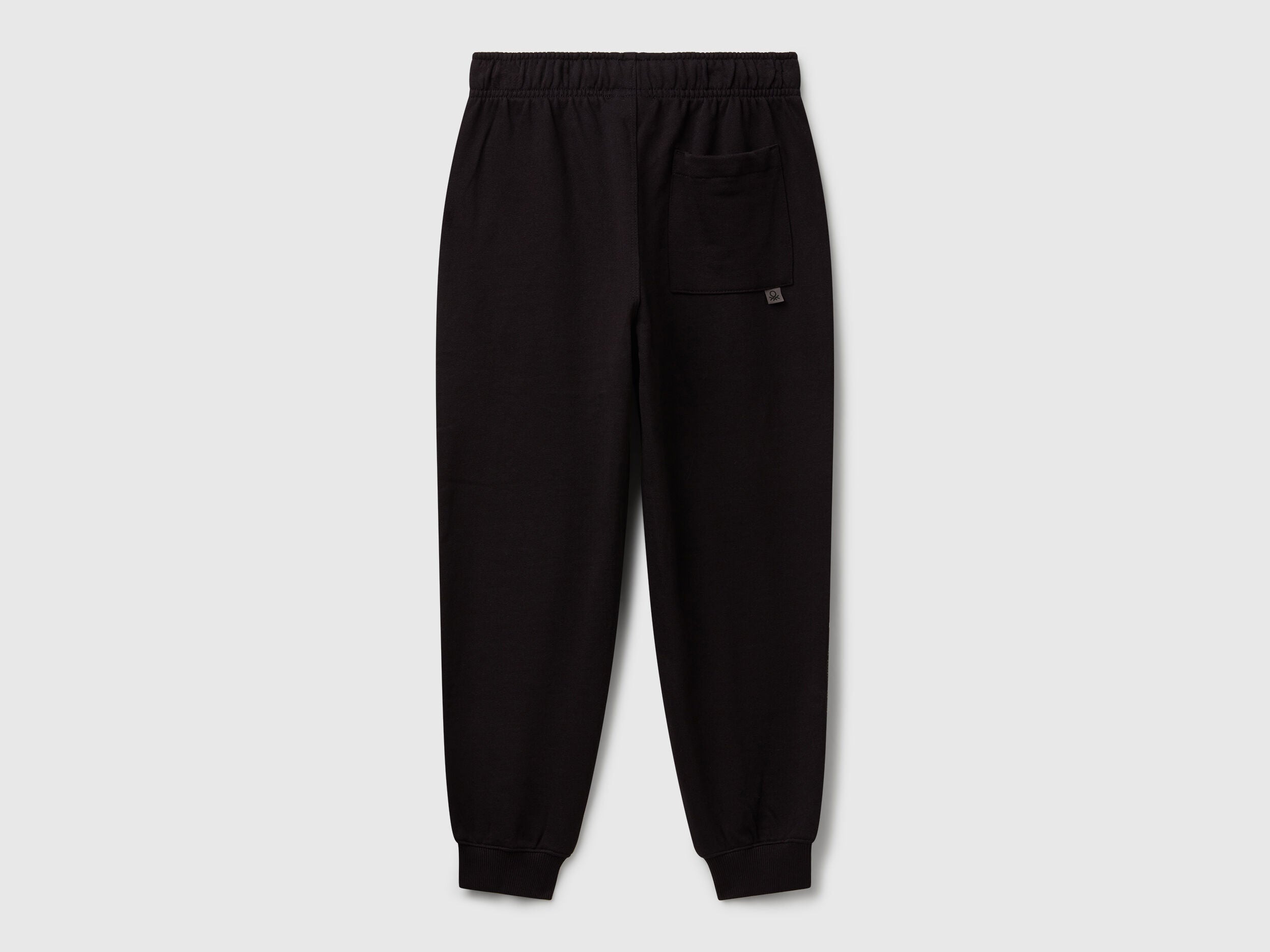 Benetton black cotton joggers side view showing patch pocket detail