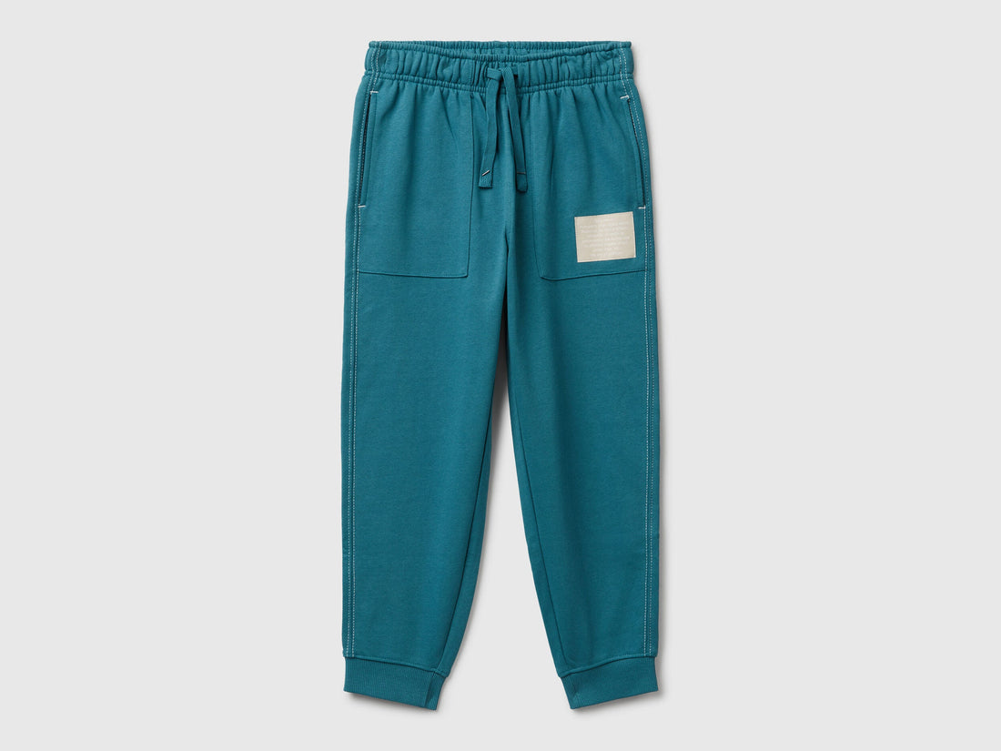 Benetton blue pure cotton joggers front view with ribbed cuffs