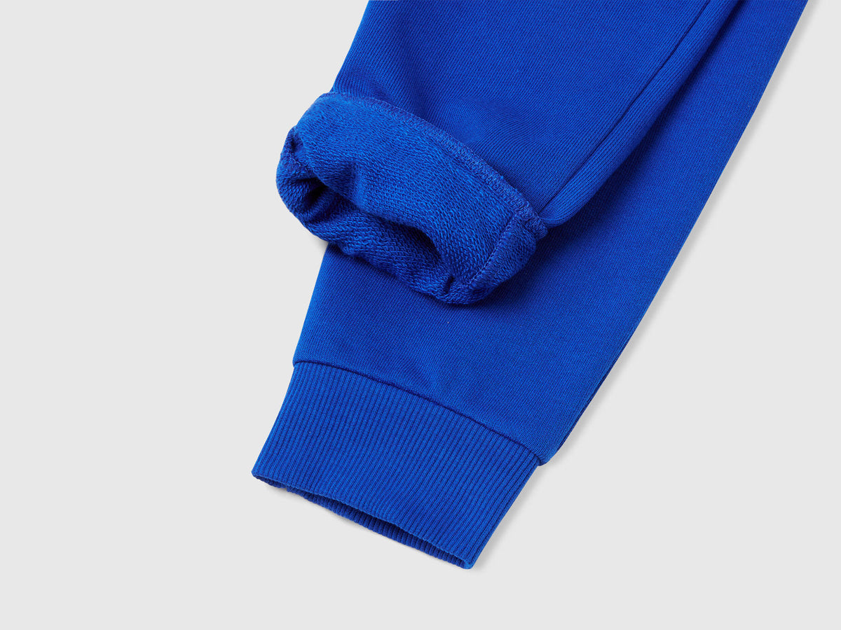 Benetton blue cotton joggers side view showing regular fit