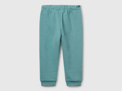 Benetton blue cotton joggers side view showing elastic waist detail