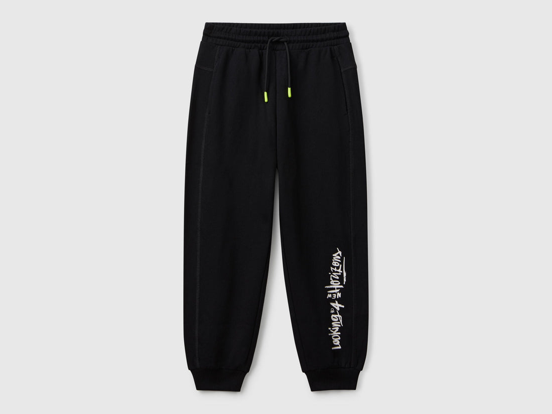 Benetton boys black graffiti print sweatpants front view with street style design