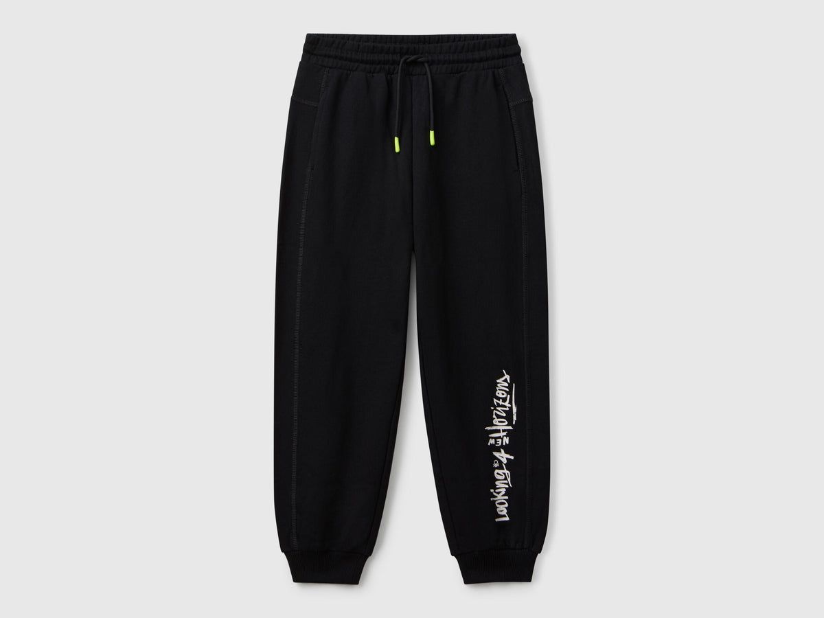 Benetton boys black graffiti print sweatpants front view with street style design