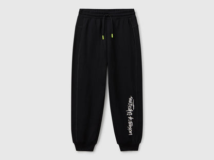 Benetton boys black graffiti print sweatpants front view with street style design