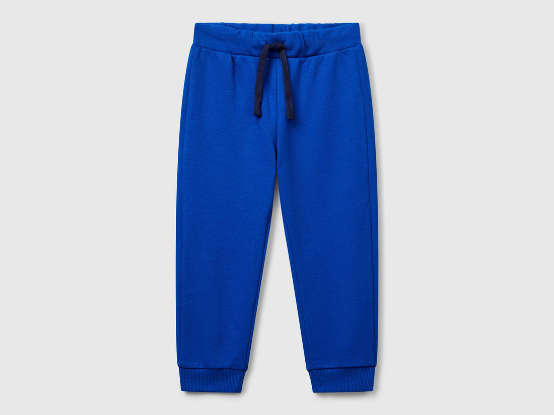 Benetton boys blue organic cotton sweatpants front view with drawstring waist