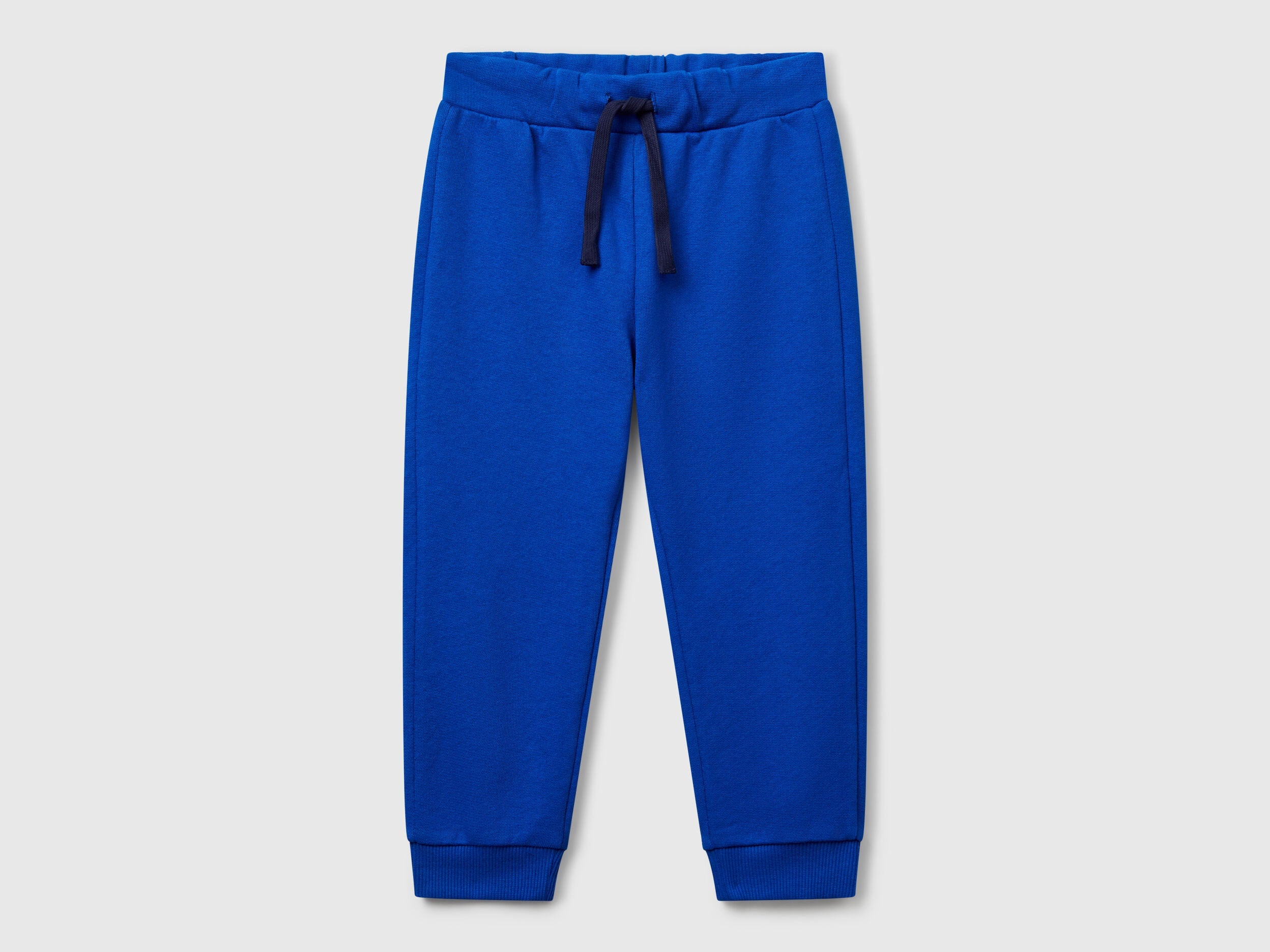 Benetton boys blue organic cotton sweatpants front view with drawstring waist