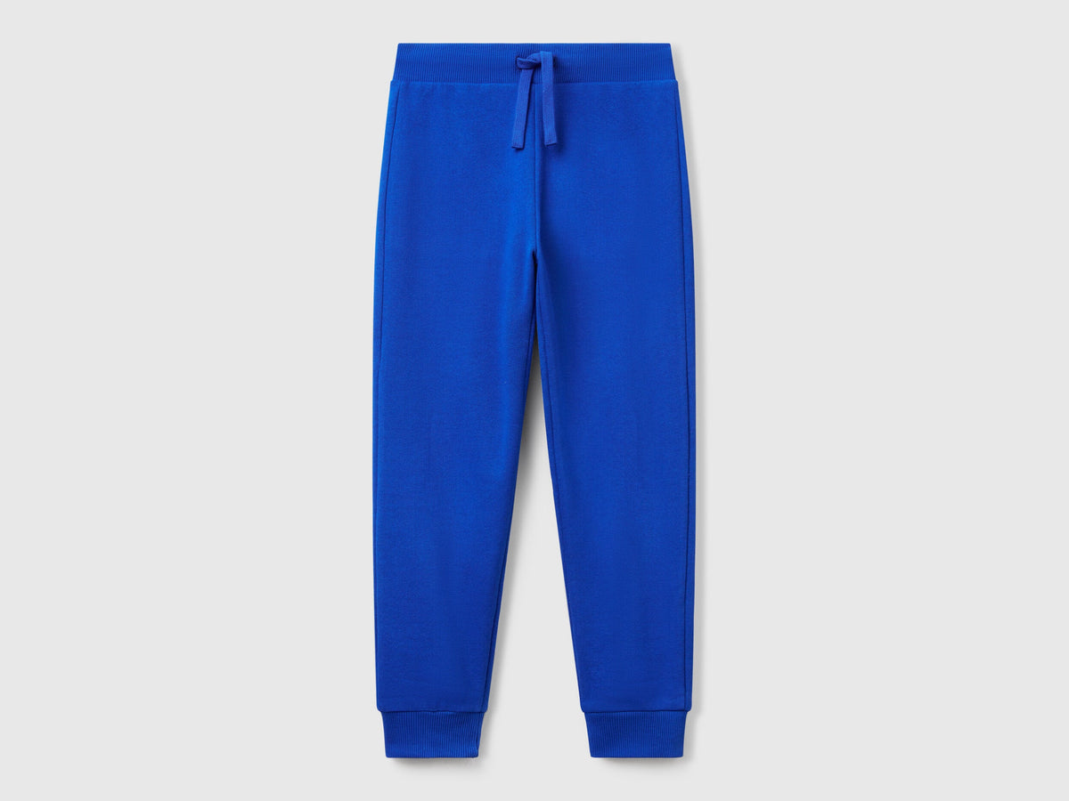Benetton boys blue sporty trousers front view with drawstring waist