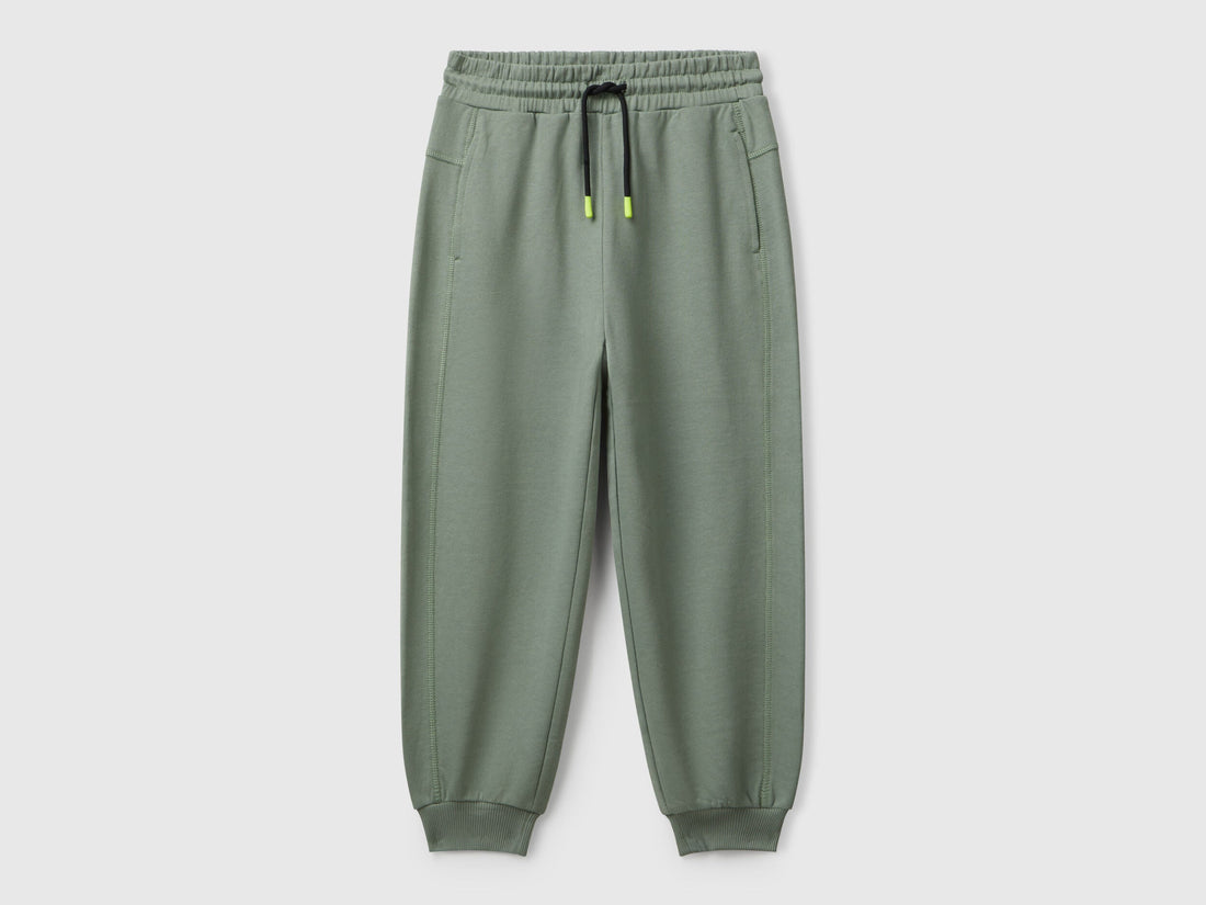 Benetton boys green graffiti print sweatpants front view with street style design