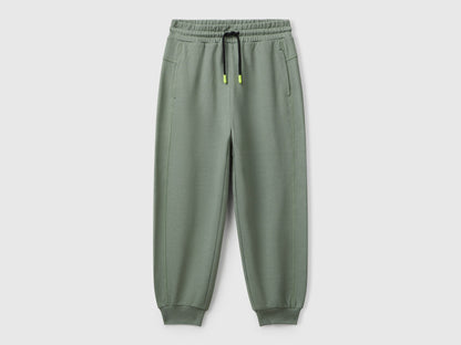 Benetton boys green graffiti print sweatpants front view with street style design