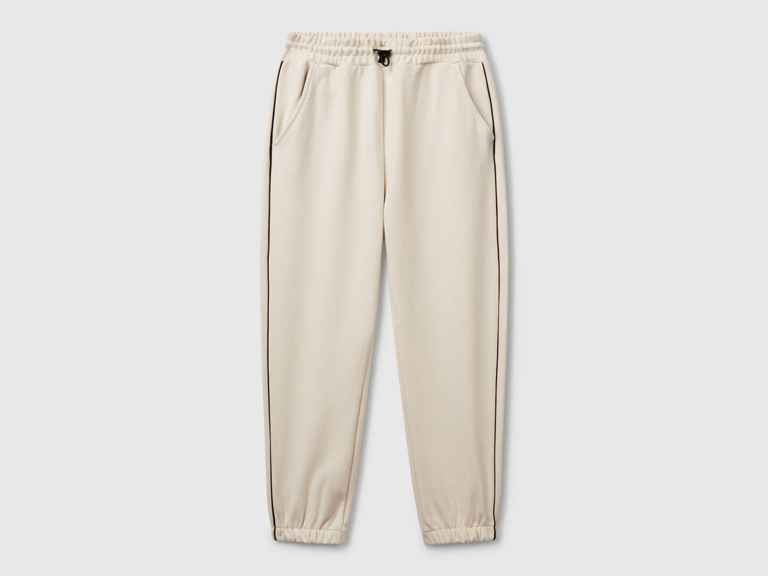 Benetton boys olive green sweatpants front view with piping detail