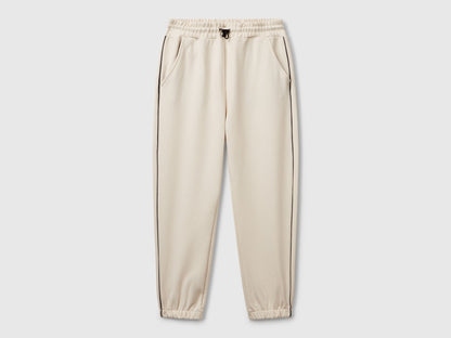 Benetton boys olive green sweatpants front view with piping detail