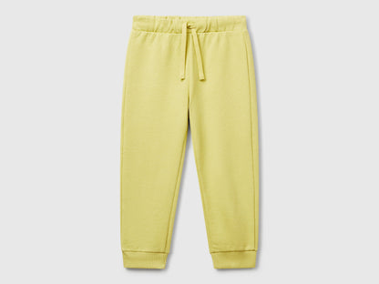 Benetton boys yellow organic cotton trousers front view with drawstring waist