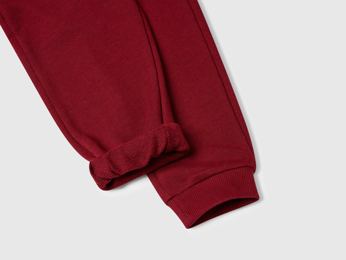 Benetton brown organic cotton trousers side view showing regular fit