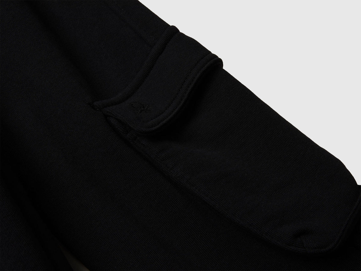 Back view of Benetton cargo joggers with drawstring waist