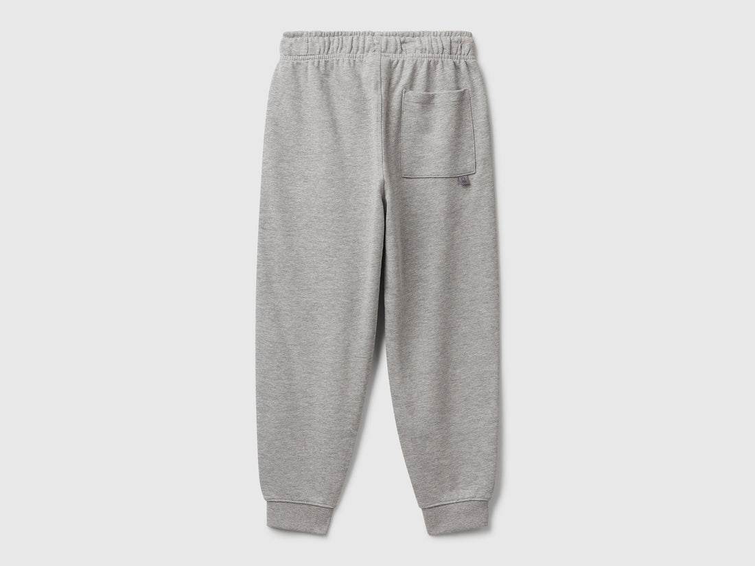 Benetton pure cotton joggers side detail view showing patch pocket