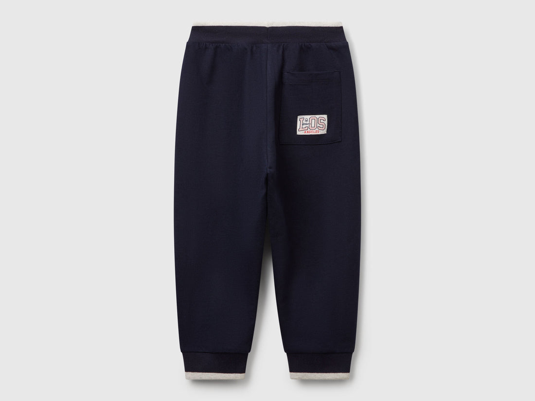 Benetton dark blue cotton joggers side view showing pocket detail