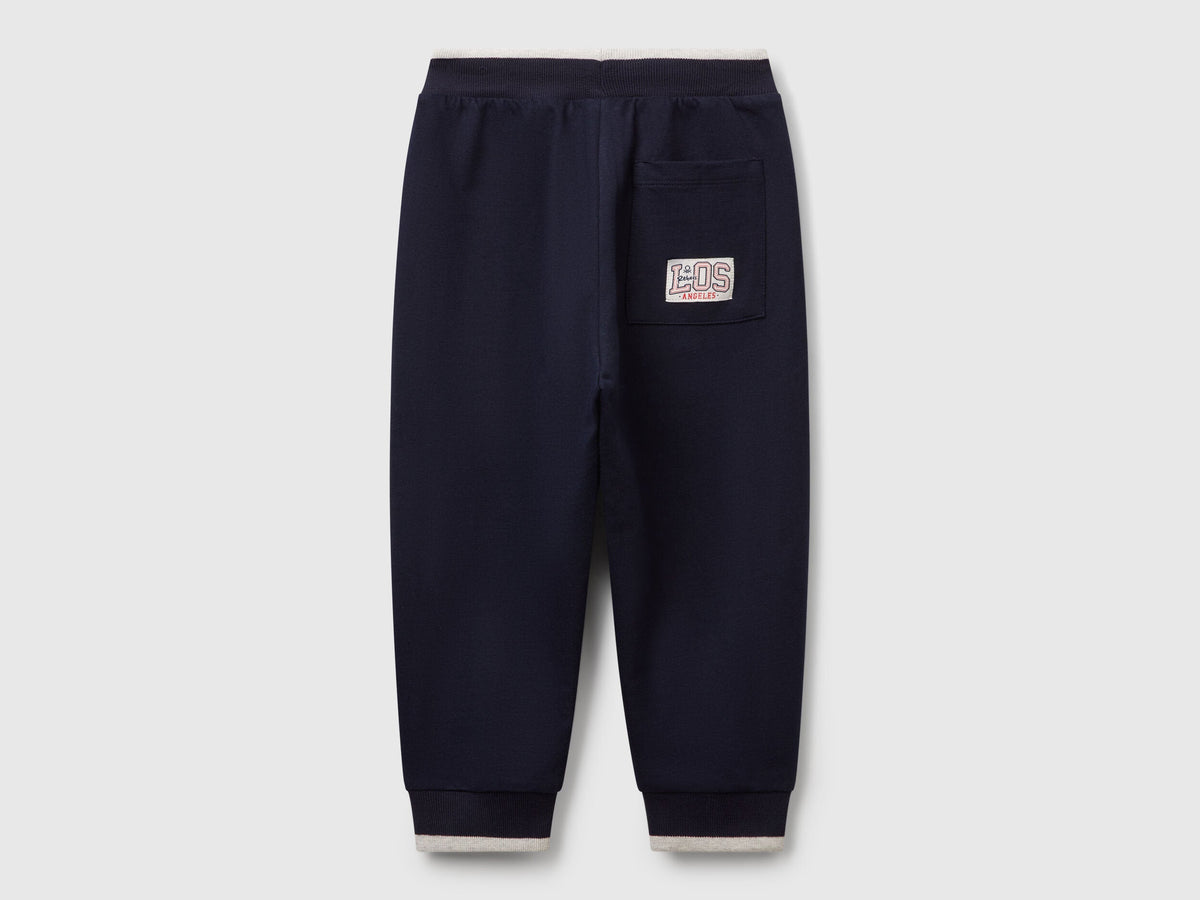 Benetton dark blue cotton joggers side view showing pocket detail