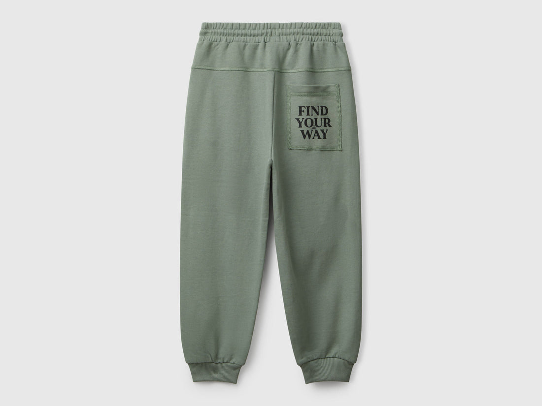 Back view of Benetton graffiti print sweatpants with patch pocket and logo detail