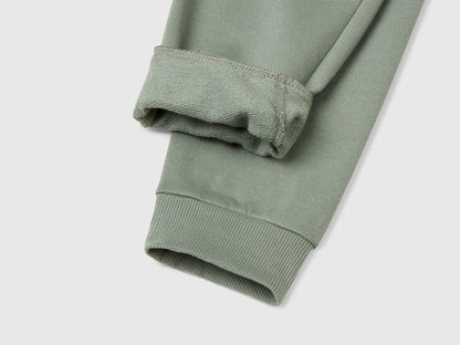 Benetton green cotton joggers side view showing regular fit