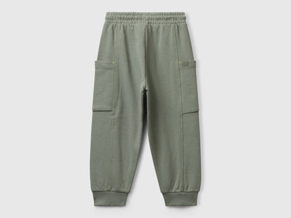 Benetton green cotton sweatpants side view showing patch detail