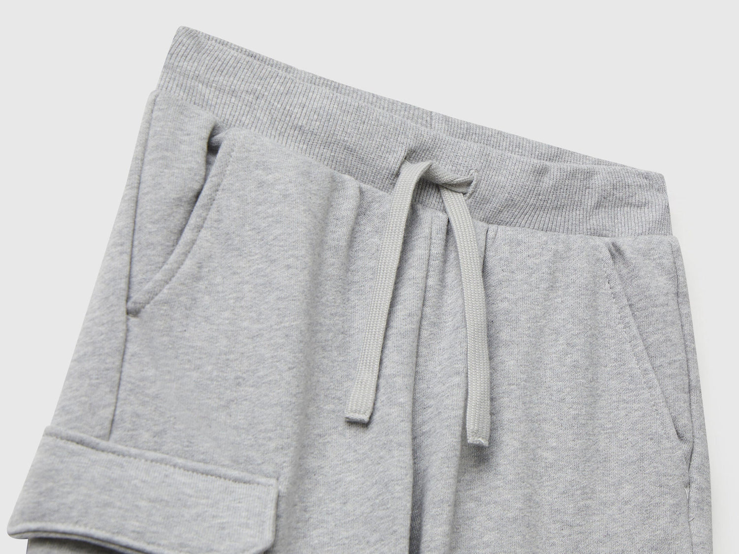 Back view of Benetton grey cargo joggers with drawstring waist