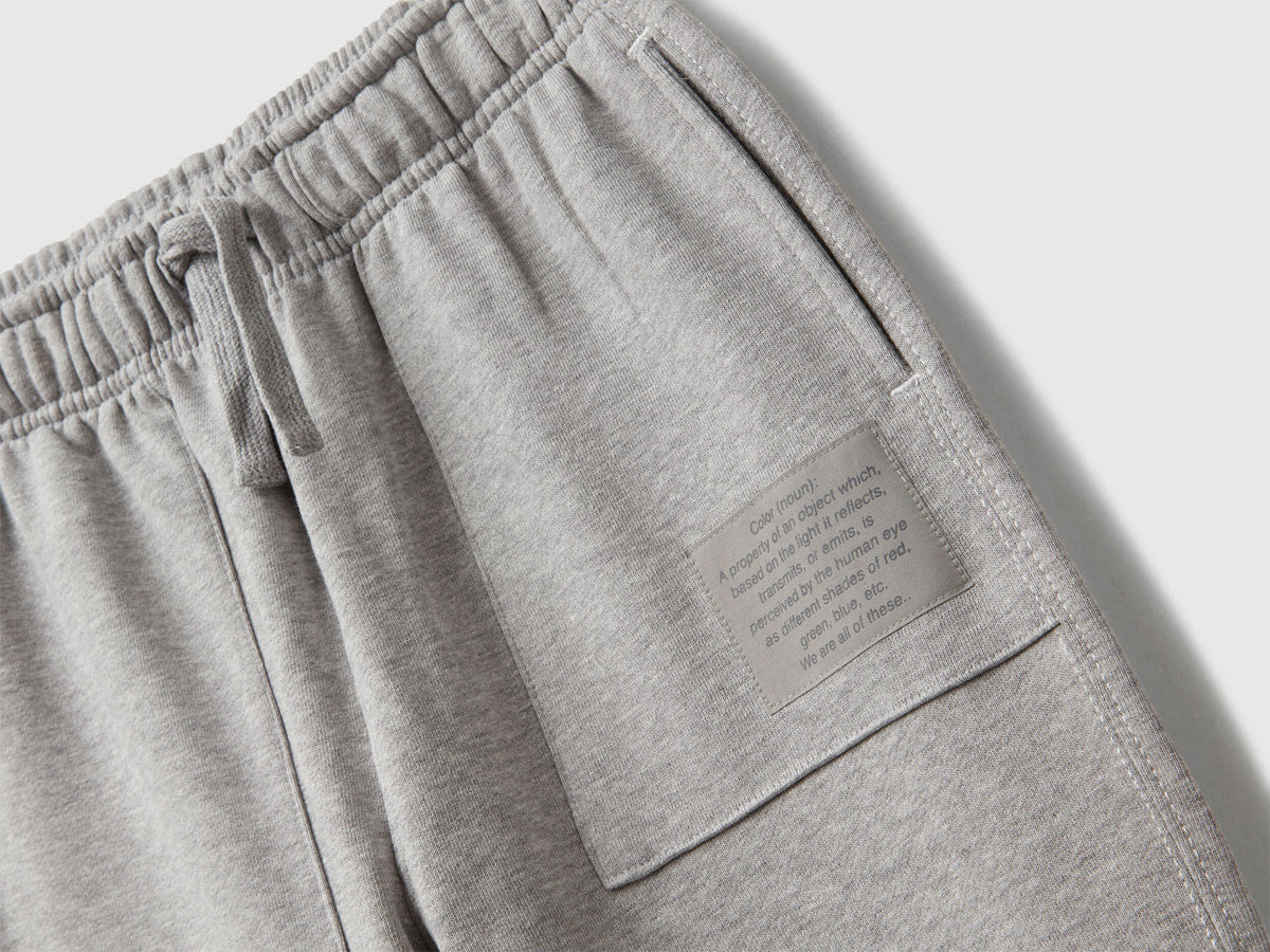 Back view of Benetton grey joggers with back pocket and logo tag