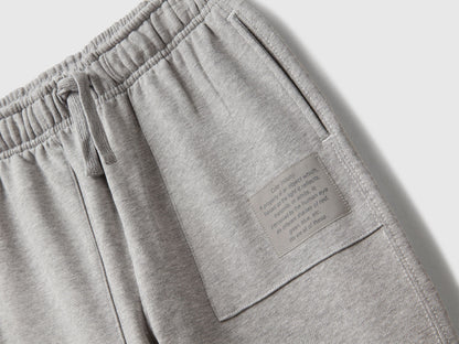 Back view of Benetton grey joggers with back pocket and logo tag
