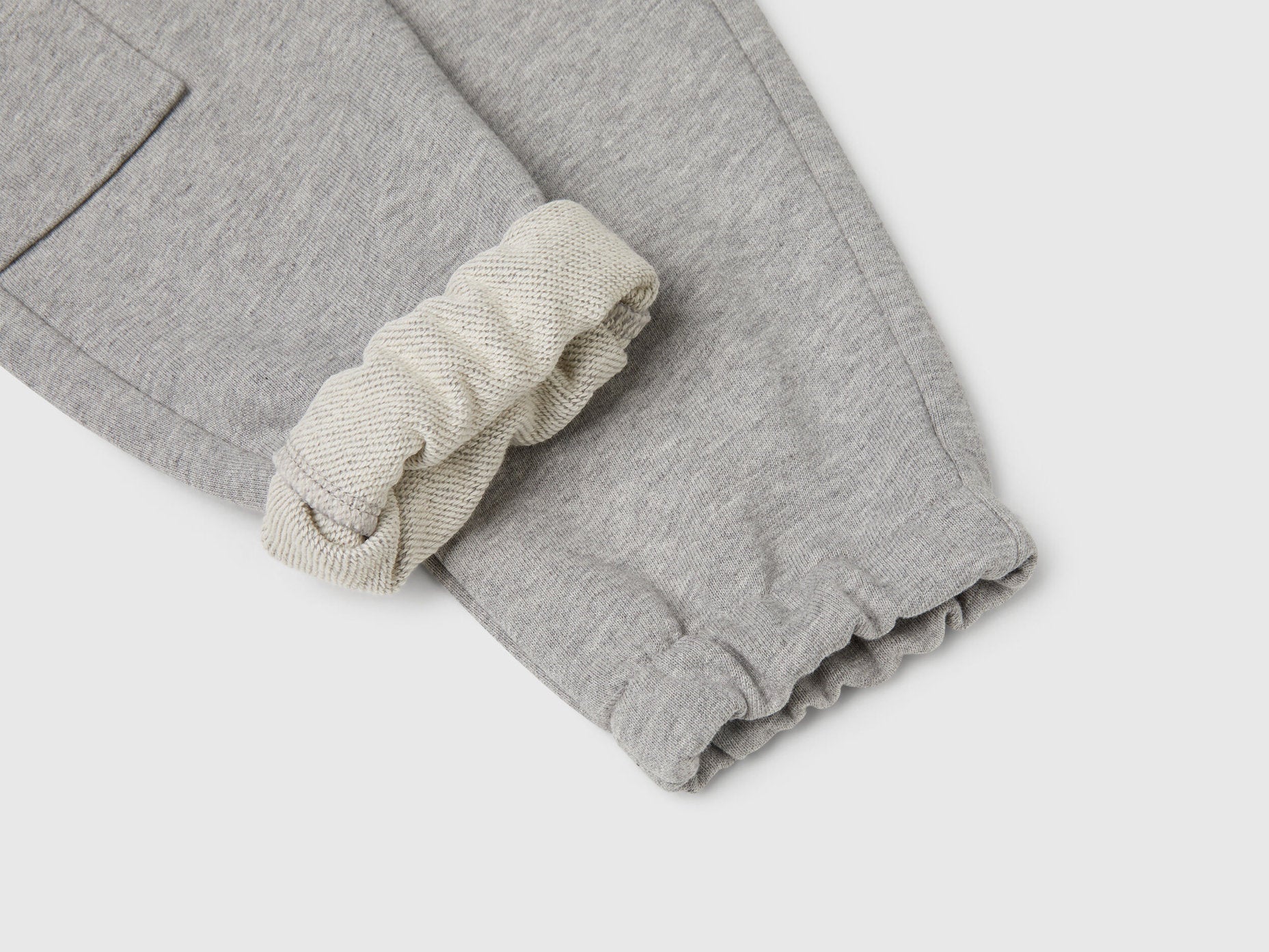 Benetton grey cotton sweatpants side view showing pocket detail
