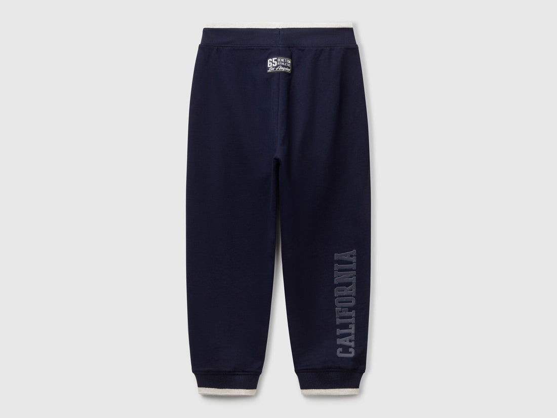 Back view of Benetton lightweight sweatpants with brand details