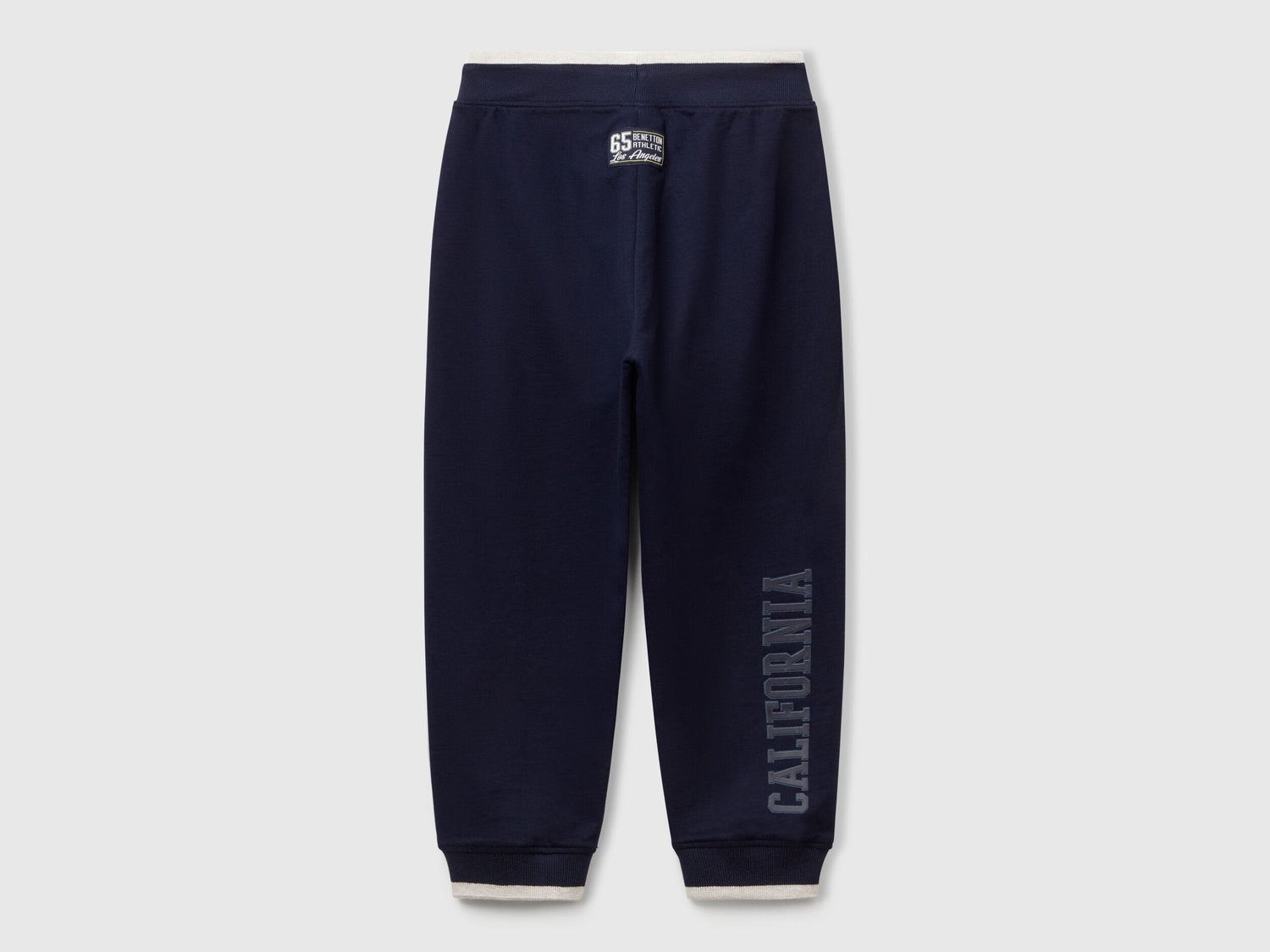 Back view of Benetton lightweight sweatpants with brand details