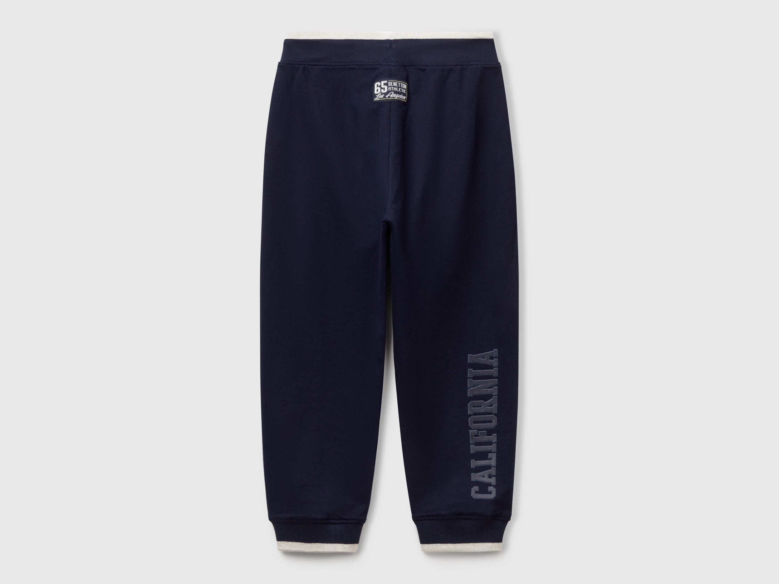Back view of Benetton lightweight sweatpants with brand details