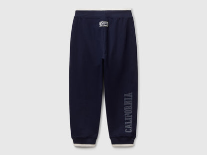 Back view of Benetton lightweight sweatpants with brand details