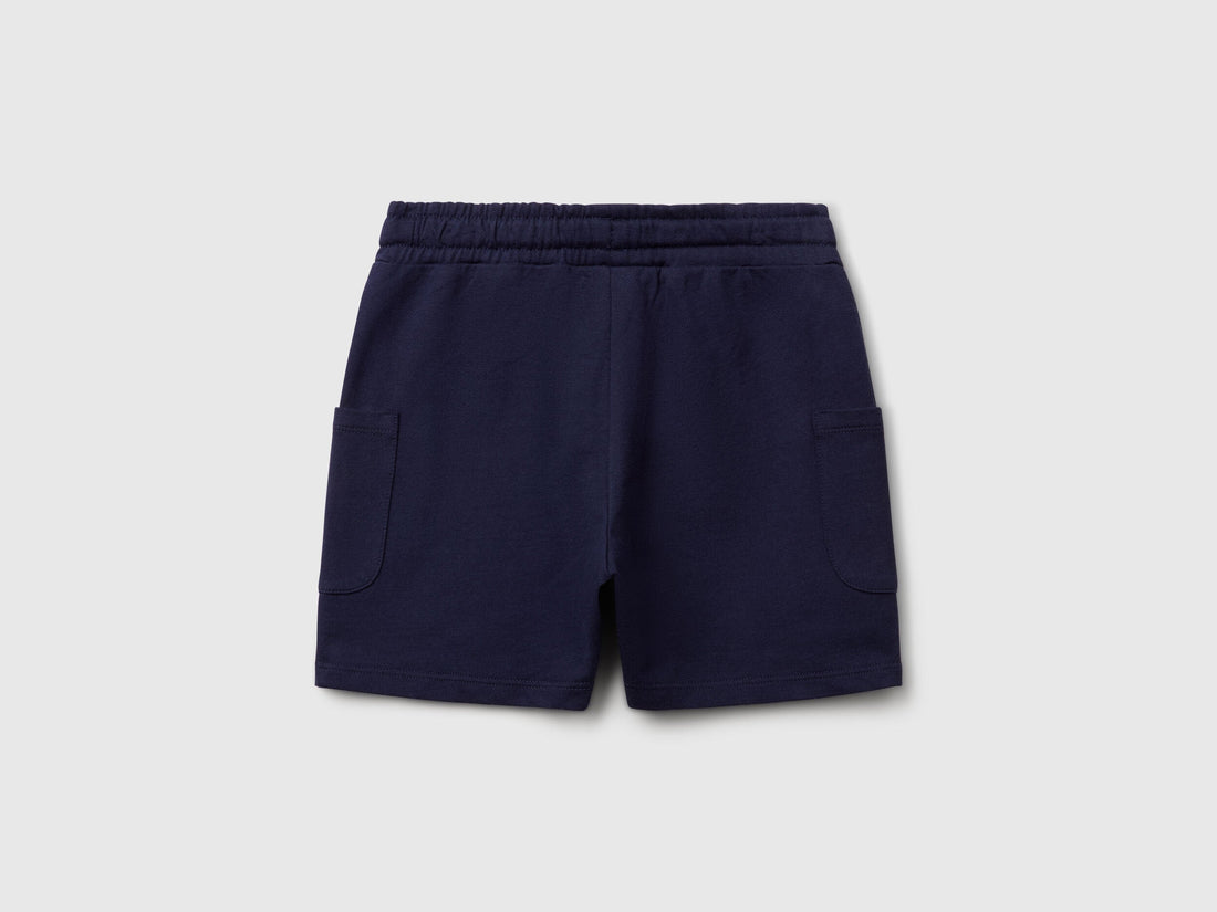 Front view of navy blue Benetton cotton cargo shorts for men, featuring side pockets and a comfortable fit.