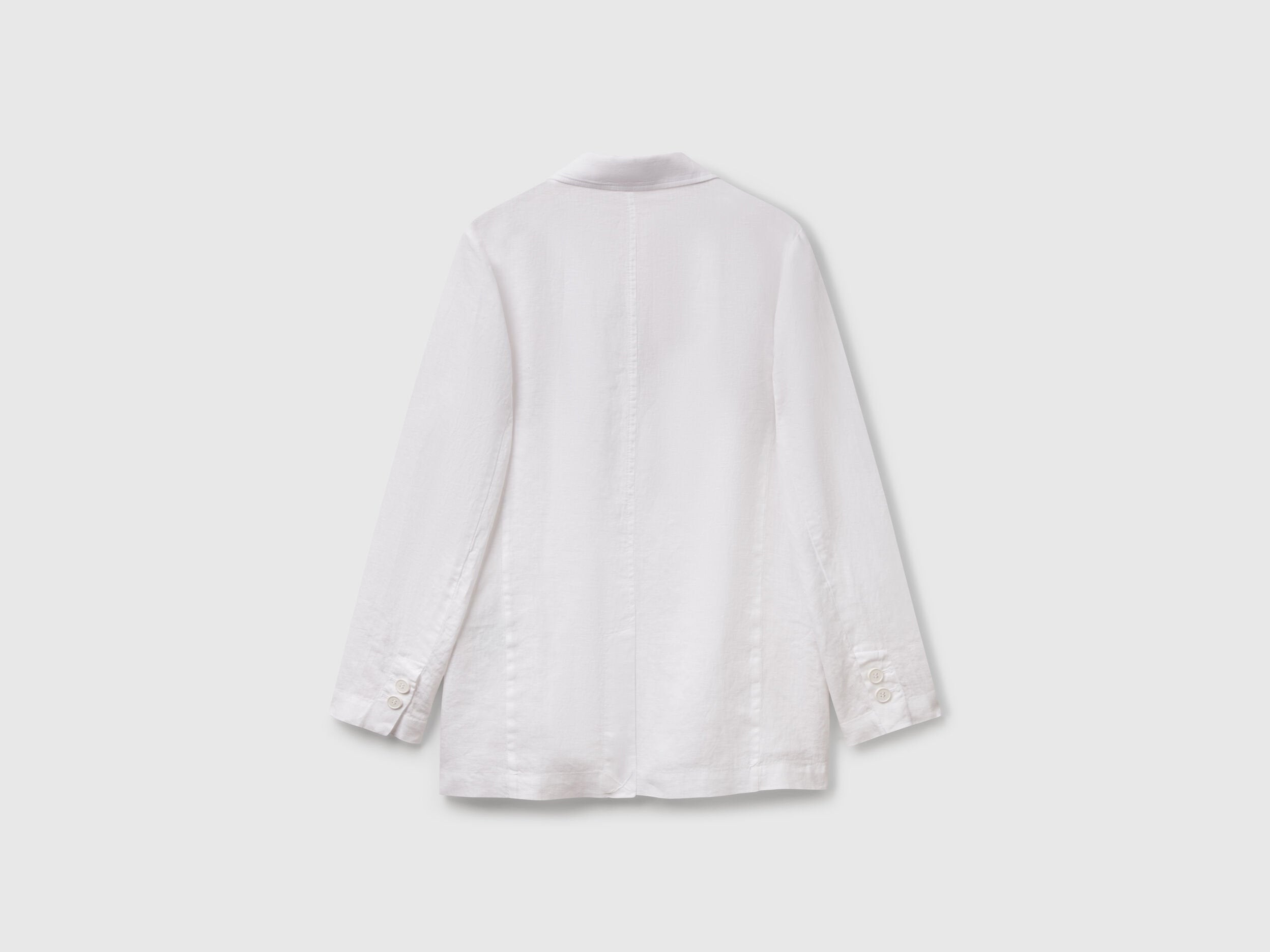 Back view of a classic white Benetton blazer made from pure linen, showcasing its light and breathable fabric.