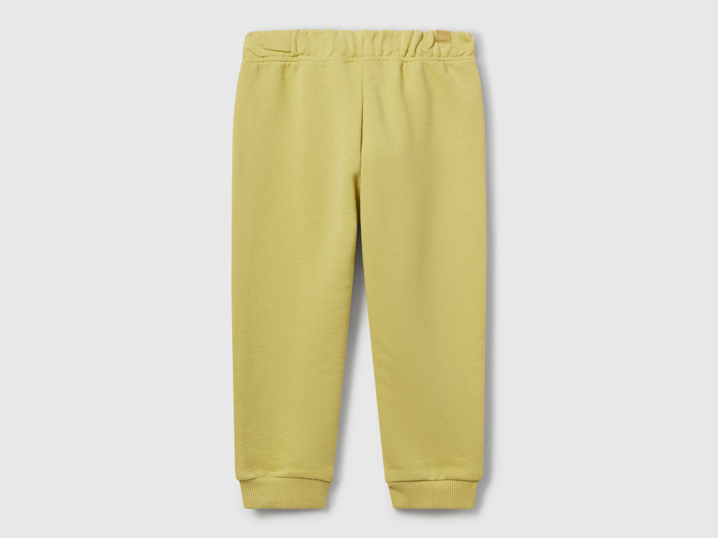 Back view of Benetton sweat joggers with logo tag and relaxed fit