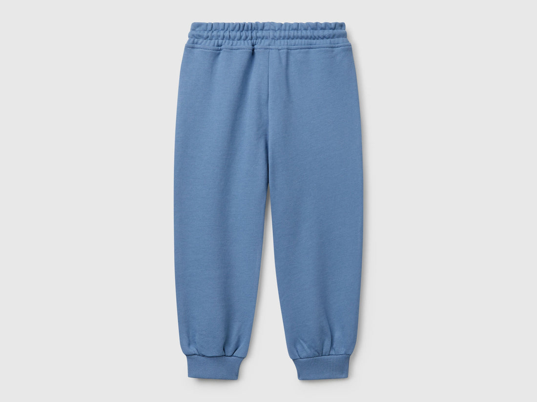 Back view of Benetton sweatpants with elastic bottom detail