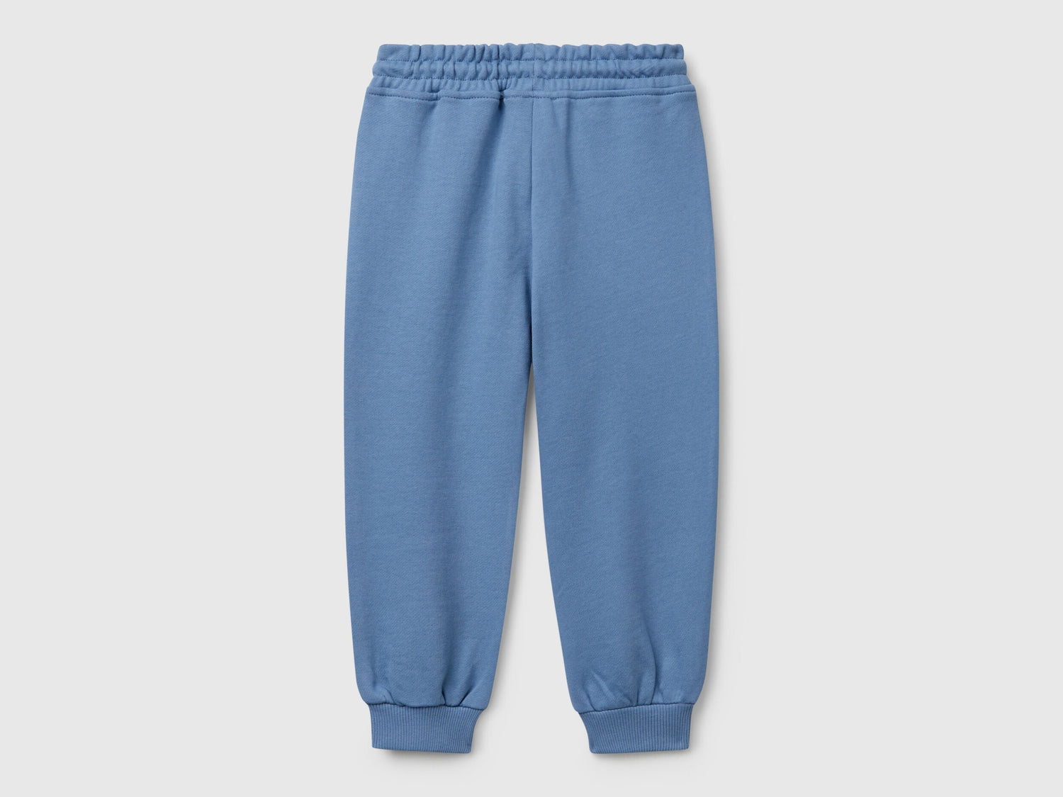 Back view of Benetton sweatpants with elastic bottom detail