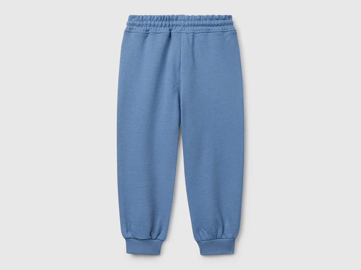 Back view of Benetton sweatpants with elastic bottom detail