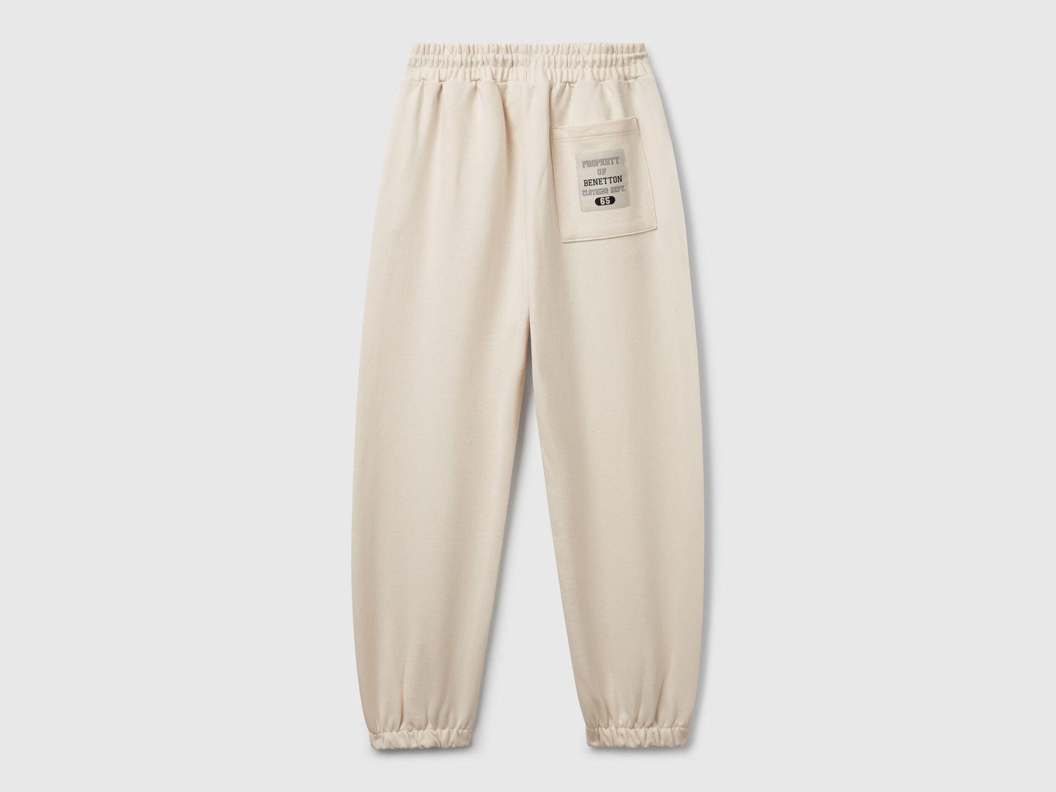 Back view of Benetton sweatpants with patch pockets and piping
