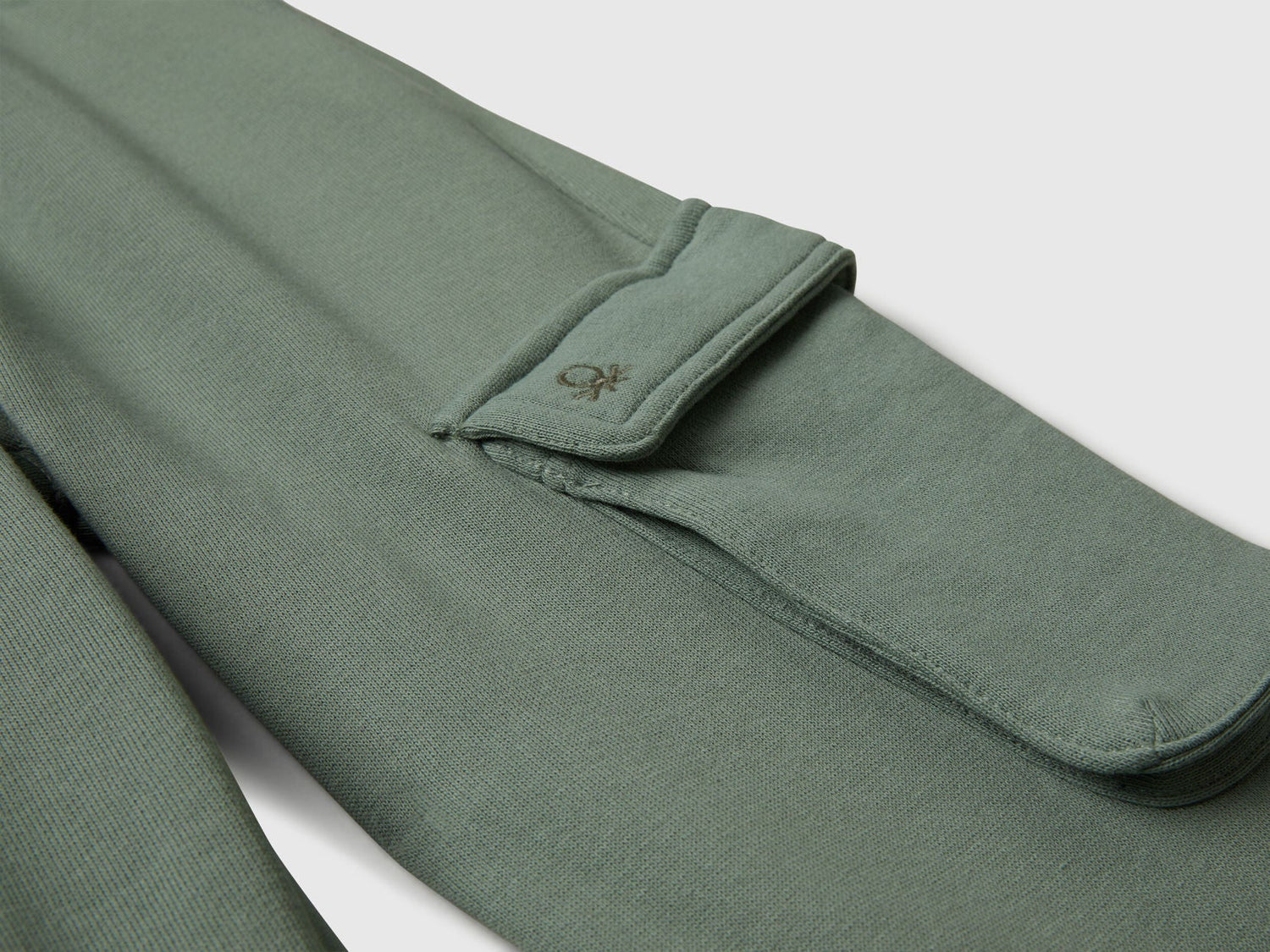 Close-up detail of Benetton sweatpants fabric and stitching
