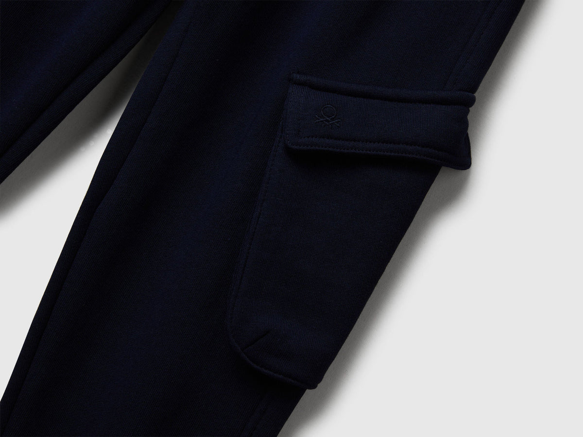 Close-up detail of Benetton sweatpants fabric and pockets